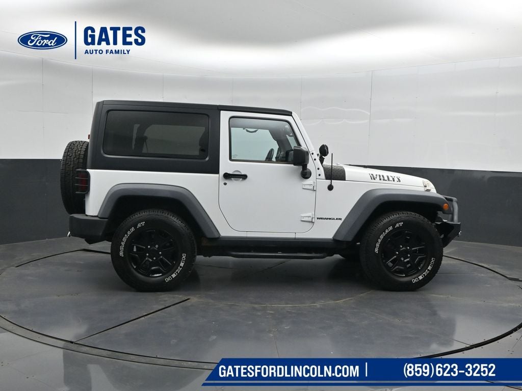 2015 Jeep Wrangler — rear three-quarter view