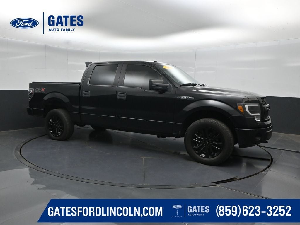 2014 Ford F-150 STX in Tuxedo Black Metallic — front three-quarter view
