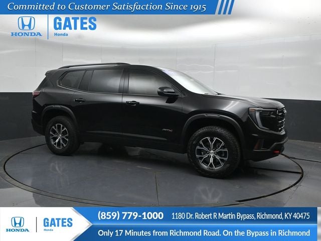 2024 GMC Acadia AT4 in Ebony Twilight Metallic — front three-quarter view