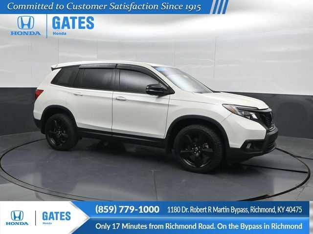 2019 Honda Passport EX-L in White Diamond Pearl — front three-quarter view