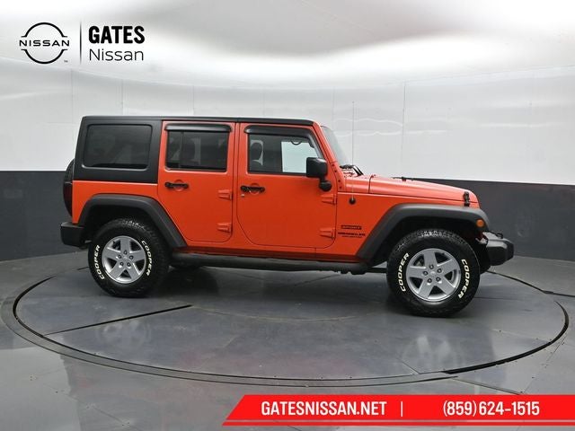 2015 Jeep Wrangler Unlimited Sport in Sunset Orange Pearlcoat — front three-quarter view