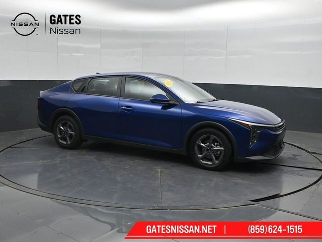 2025 Kia K4 LXS in Deep Sea Blue — front three-quarter view