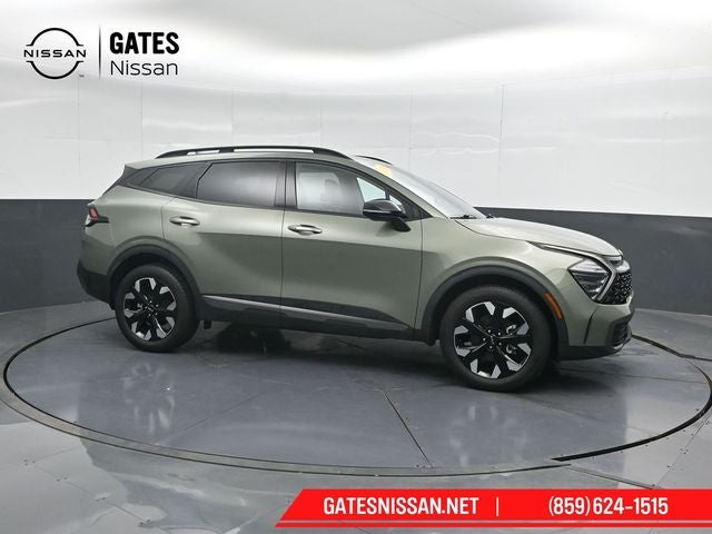 2024 Kia Sportage X-Line in Jungle Green — front three-quarter view