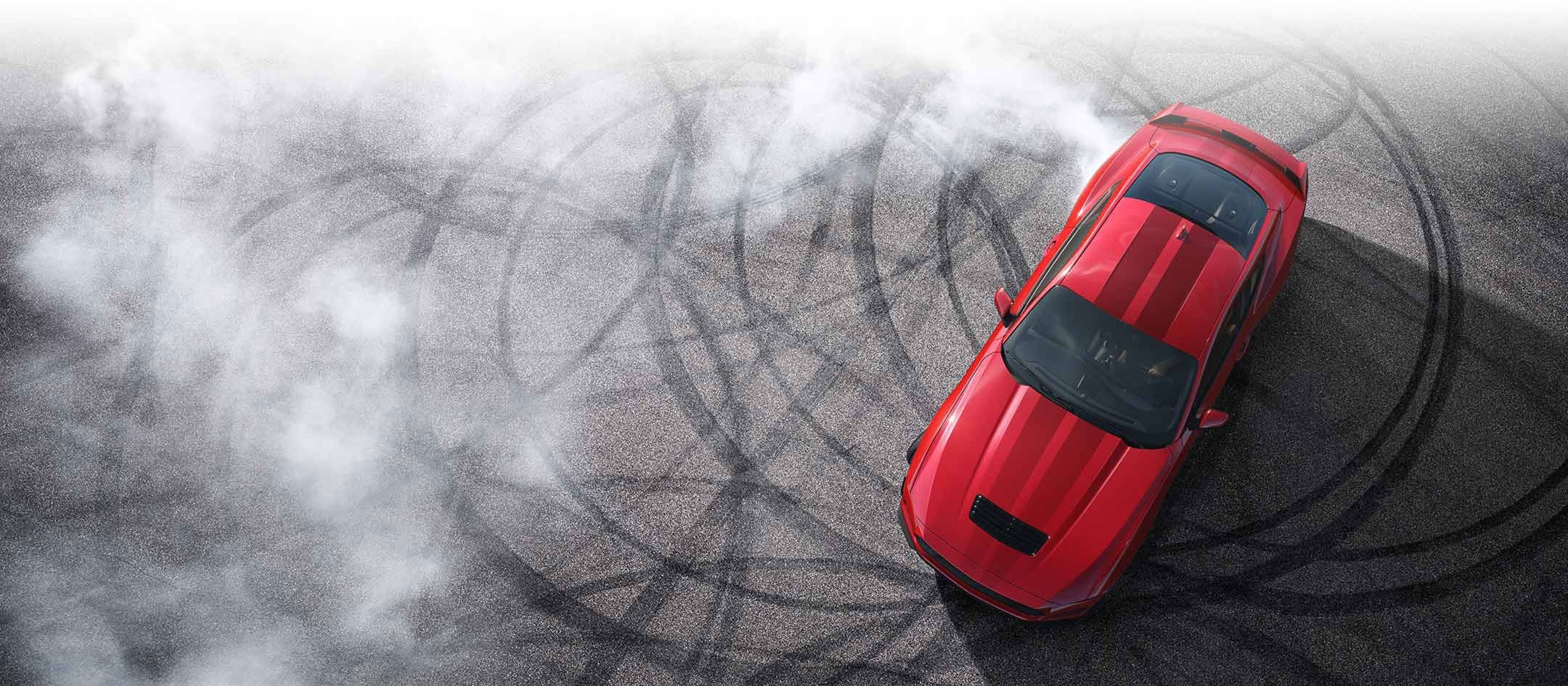 Overhead view of a 2024 Ford Mustang® model with tire tracks on pavement | Gates Ford Lincoln in Richmond KY