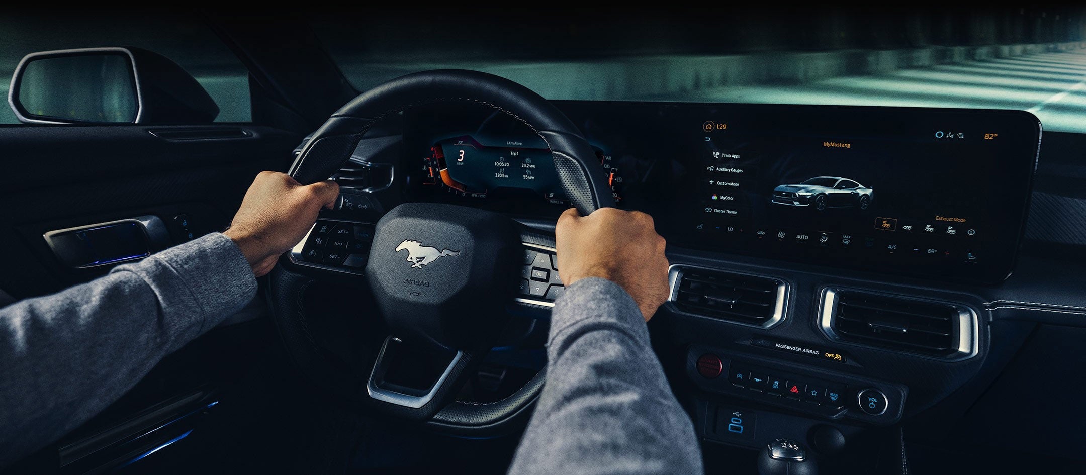 A 2024 Ford Mustang® model interior with a person driving | Gates Ford Lincoln in Richmond KY